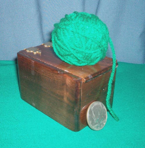 coin in ball of wool